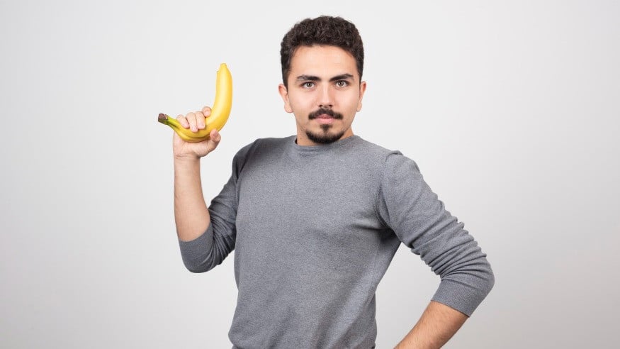 Ilustrasi Pria Memegang Pisang