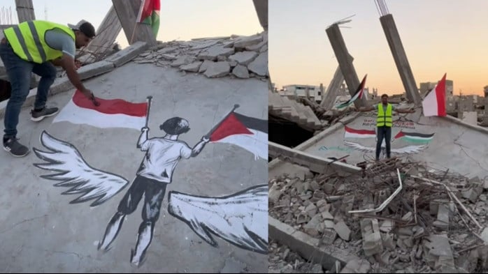 Seniman asal Gaza melukiskan di reruntuhan bangunan