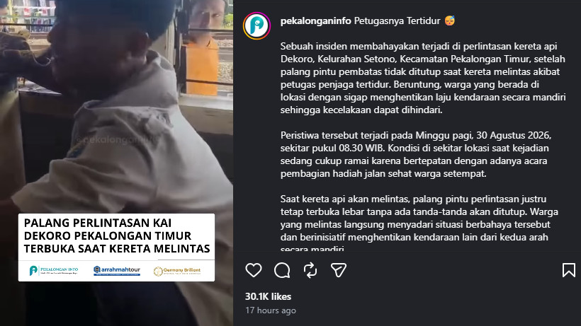 Petugas pintu perlintasan KA tertidur saat kereta api melintas di Pekalongan