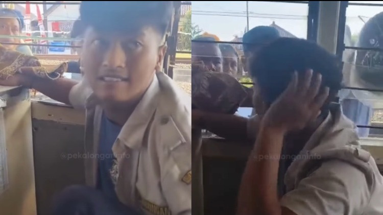 Petugas pintu perlintasan KA tertidur saat kereta api melintas di Pekalongan