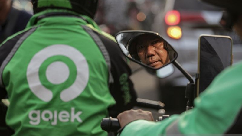 Ilustrasi pengemudi ojek online.